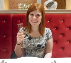 Celebrating with a glass of champagne: Here is to travel in your twenties!