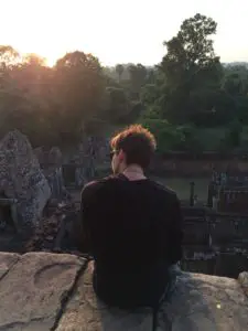 Tim watching the sunset in the Angkor archaeological Park. You can find yourself if you travel in your twenties!