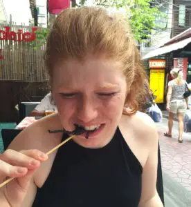 Braving the Thai street food and munching on a scorpion. Who said the travel commandments weren't yummy!?