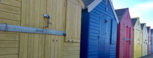 Colourful beach huts along Mundesley Beach, Norfolk