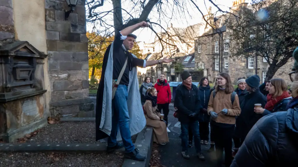 Guide dressed in cloak on Harry Potter tour, Edinburgh.