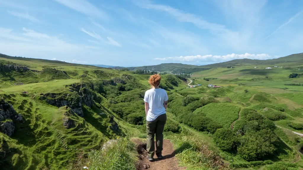 Girl overlooks scenery at Fairy Glen on Isle of Skye