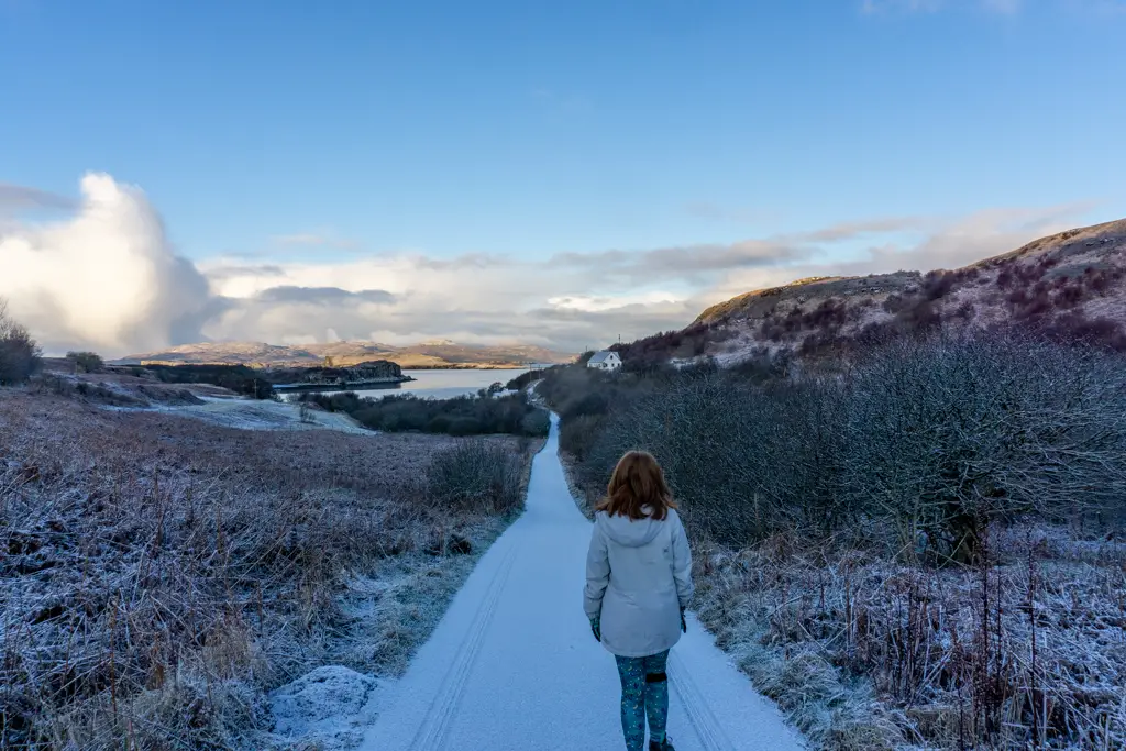 Snow on the Isle of Skye with girl walking