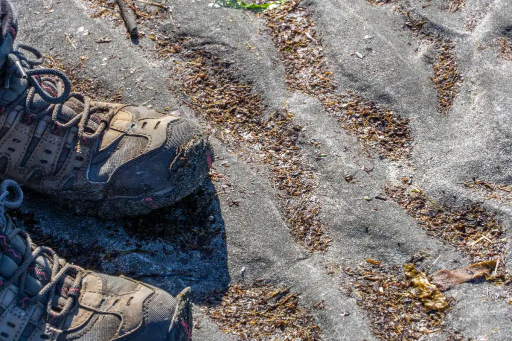 Black sand and hiking boots